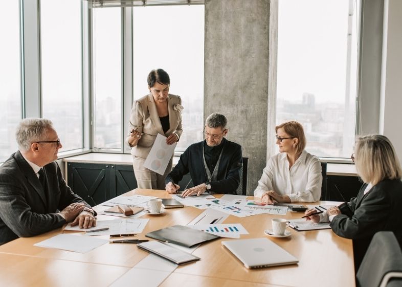 Business professionals collaborating in strategy meeting